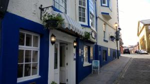 a blue and white building on a street at Blands Cliff Lodge in Scarborough