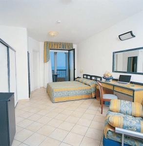 Postel nebo postele na pokoji v ubytování Hotel Parco Dei Principi