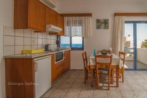 A kitchen or kitchenette at Roula Apartments