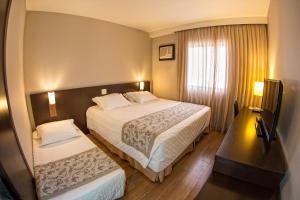 Postel nebo postele na pokoji v ubytování Hotel Campo Largo Comfort