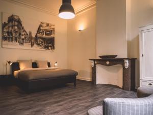 En eller flere senge i et værelse på Maison Willem Tell