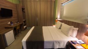 Postel nebo postele na pokoji v ubytování Mais Hotel Aeroporto Salvador