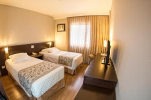 Postel nebo postele na pokoji v ubytování Hotel Campo Largo Comfort