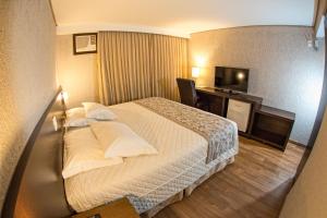 Postel nebo postele na pokoji v ubytování Hotel Campo Largo Comfort