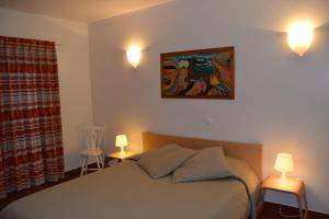 A bed or beds in a room at Casa da Praia | Luz Beach