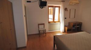 Postel nebo postele na pokoji v ubytování Al Pian Garnì Hotel - B&B & Pizza