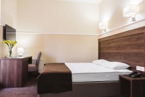 Postel nebo postele na pokoji v ubytování Potemkinn Hotel