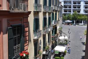 a view of a street from a building with a truck at Capofortuna B&B Salerno Centro in Salerno