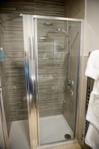 a shower with a glass door in a bathroom at Bank House B&B in Bishops Castle +23 photos