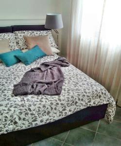 Posteľ alebo postele v izbe v ubytovaní Capo House