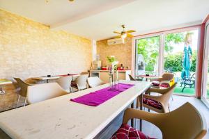 a dining room with a large table and chairs at Apartments Vanja in Bar