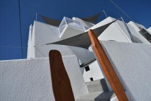 a close up of a white building with a roof at AMO Folegandros in Karavostasi