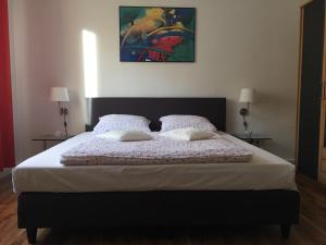 Ein Bett oder Betten in einem Zimmer der Unterkunft Lorenz Apartment