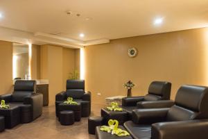 a waiting room with chairs and a waiting table at Boracay Haven Suites in Boracay