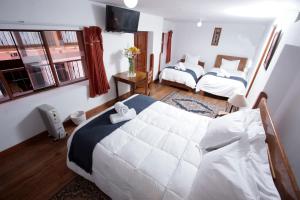 Voodi või voodid majutusasutuse Casa Union Cusco toas
