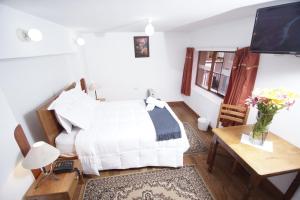 Voodi või voodid majutusasutuse Casa Union Cusco toas