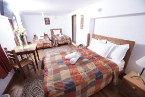 Voodi või voodid majutusasutuse Casa Union Cusco toas