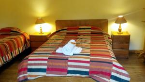 Postel nebo postele na pokoji v ubytování Kukuli Lodge B&B