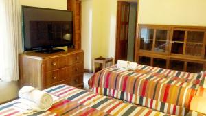 Postel nebo postele na pokoji v ubytování Kukuli Lodge B&B