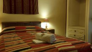 Postel nebo postele na pokoji v ubytování Kukuli Lodge B&B