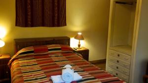 Postel nebo postele na pokoji v ubytování Kukuli Lodge B&B