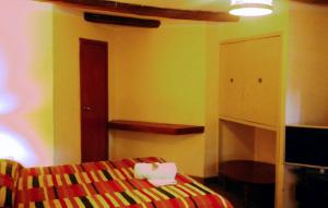 Postel nebo postele na pokoji v ubytování Kukuli Lodge B&B