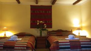 Postel nebo postele na pokoji v ubytování Kukuli Lodge B&B