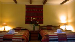 Postel nebo postele na pokoji v ubytování Kukuli Lodge B&B