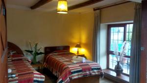 Postel nebo postele na pokoji v ubytování Kukuli Lodge B&B