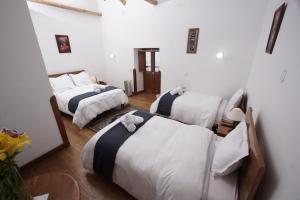 Voodi või voodid majutusasutuse Casa Union Cusco toas