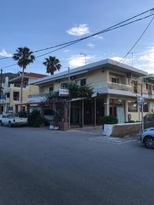 an empty street in front of a building at Neapolis Apartments in Palaiochora