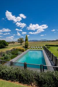 a swimming pool in the middle of a field at Goonoo Goonoo Station in Tamworth