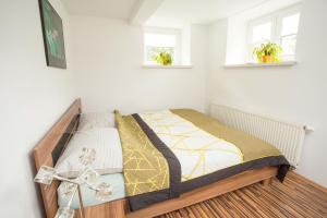 Letto o letti in una camera di Apartmán Harrachov se zahradou