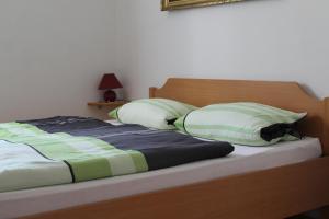 Postel nebo postele na pokoji v ubytování Apartmenthaus Fa
