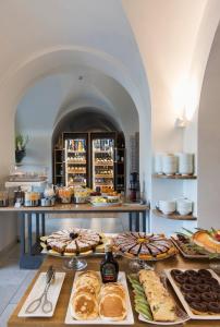 a table with many different types of bread and pastries at Grand Hotel Portovenere in Portovenere