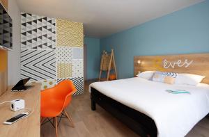 Postel nebo postele na pokoji v ubytování Hôtel Baudouin