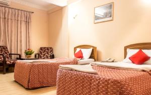Voodi või voodid majutusasutuse Hotel Kamal toas
