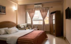 Voodi või voodid majutusasutuse Hotel Kamal toas