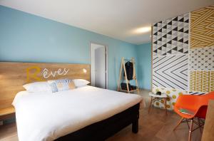 Postel nebo postele na pokoji v ubytování Hôtel Baudouin