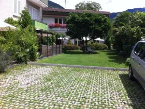 a car parked in front of a house at Casa al Lido in Locarno