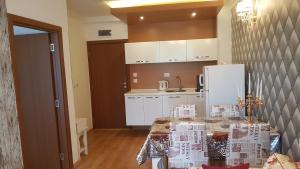 a kitchen with a table with boxes on it at Apartments Sweet Home 4 in Sunny Beach