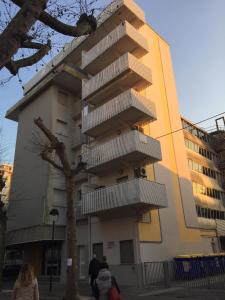 a building with balconies on the side of it at Solemare Federica in Lignano Sabbiadoro