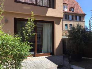 a house with a pivot door in front of it at Apartment am Schlosshof in Besigheim