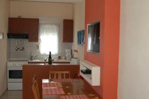 a small kitchen with a table and a counter top at Aegean Villas in Potos