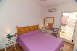 Ένα ή περισσότερα κρεβάτια σε δωμάτιο στο Casa Piras