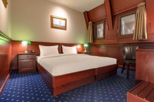 
Łóżko lub łóżka w pokoju w obiekcie Hotel Senigallia
