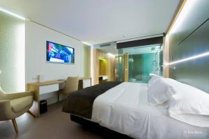 Cama o camas de una habitación en Hotel & Spa Ciudad de Binéfar