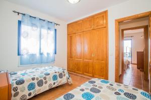 Ein Bett oder Betten in einem Zimmer der Unterkunft Villa Aitonita