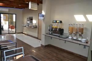 a kitchen with a counter with a food mixer at Mesami Hotel in Durban