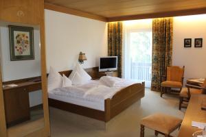 Postel nebo postele na pokoji v ubytování Hotel Alpina